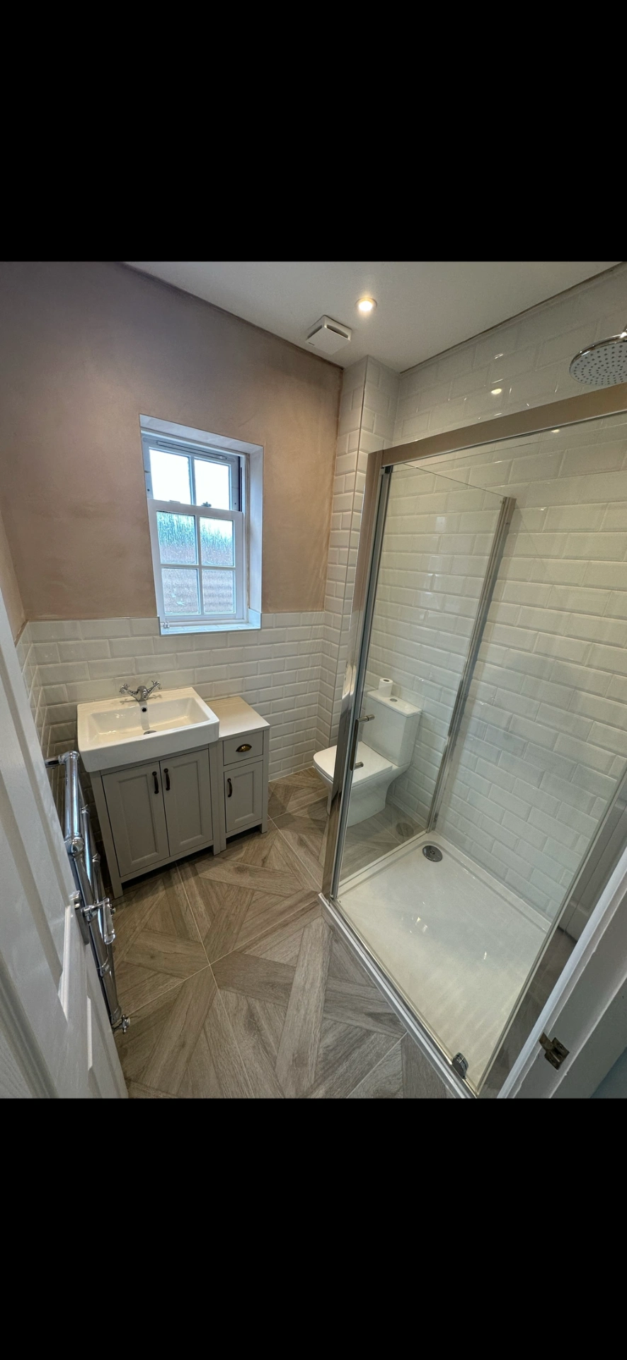 Traditional cloakroom shower room with grey shaker vanity, metro tiles and parquet floor — bathroom renovation