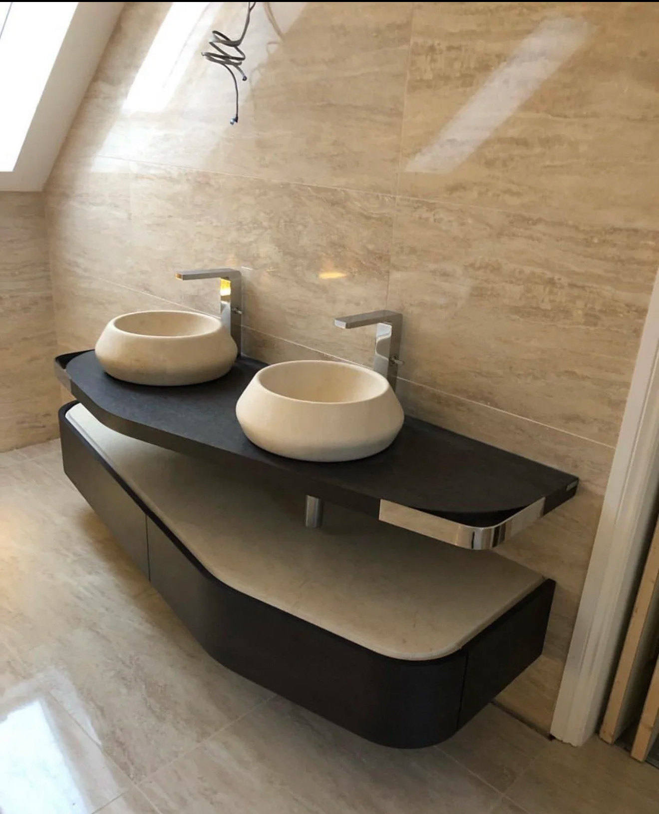 Bespoke double stone basin vanity in a travertine bathroom in Reading