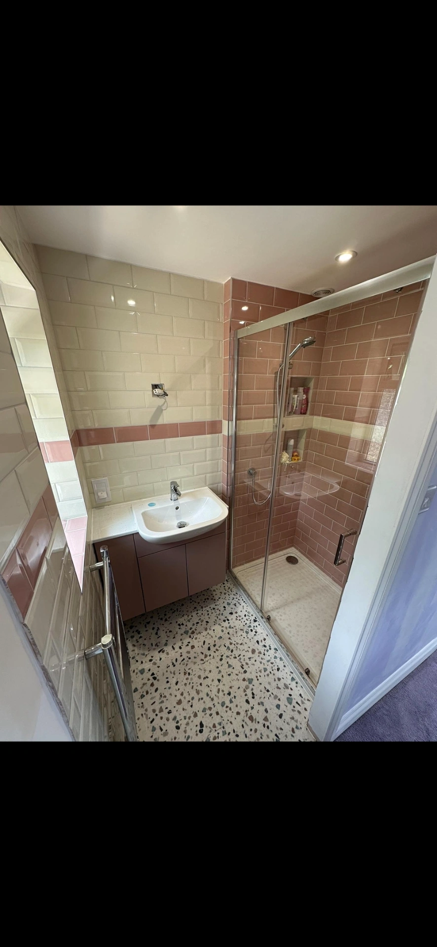 Pink and cream metro-tiled shower room with terrazzo floor — bathroom renovation