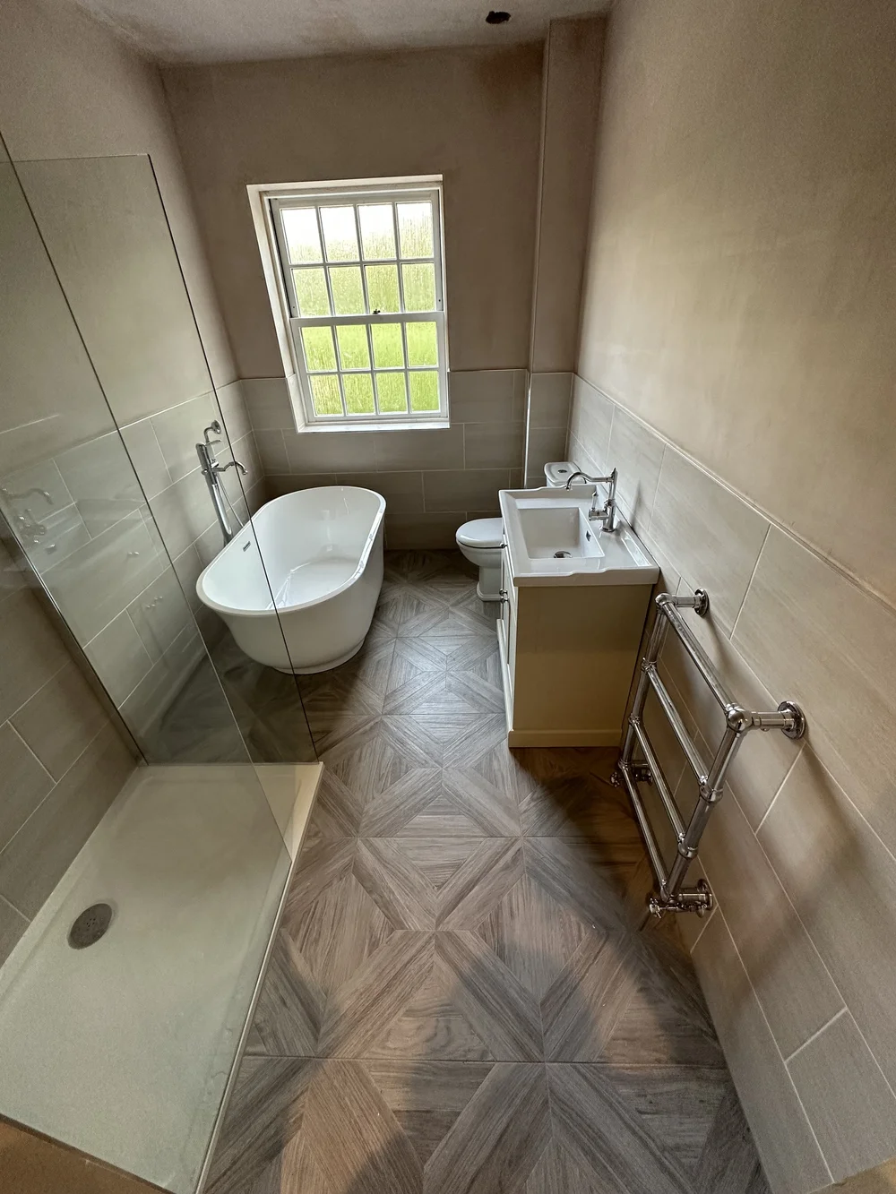 Traditional bathroom with freestanding slipper bath, cream shaker vanity and parquet floor — bathroom renovation in Reading
