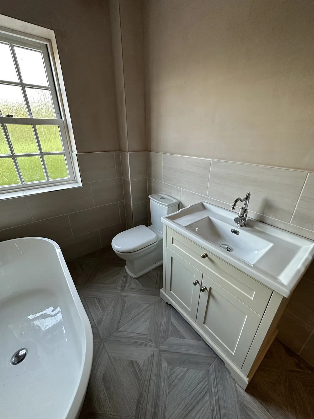 Traditional bathroom with cream shaker vanity, chrome tap and parquet floor — bathroom renovation